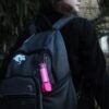 Personal Pepper Spray - Neon Pink on backpack