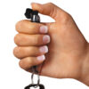 Mini Keychain Pepper Spray - Black being held in hand for size